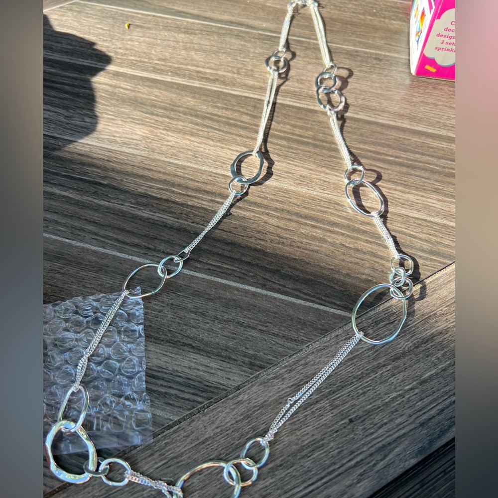 Chloe + Isabel silver loop long necklace and bracelet set.